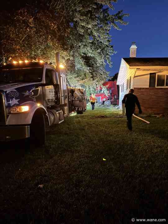 PHOTOS: Semi veers off US 30, narrowly avoiding house