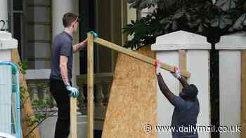 Businesses and homeowners in affluent West London begin to board up their shops and homes ahead of Notting Hill Carnival