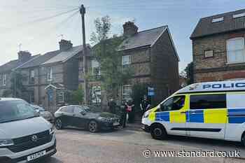 Floral tributes laid after man and three children found dead in house