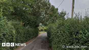 Woman's body found in country lane