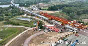 See Britain&#39;s longest railway bridge near Watford as last piece added