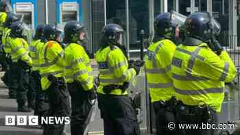 Police officer sprayed with petrol during riots