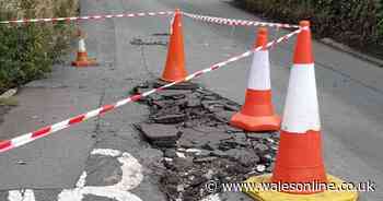 Road closed as large sinkhole opens up