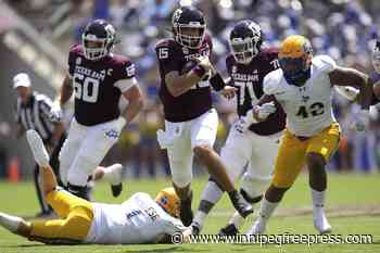 Weigman throws 2 TD passes, Moss runs for 2 scores before halftime as A&M routs McNeese State 52-10