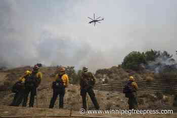 Evacuations ordered as wildfire burns in foothills of national forest east of LA