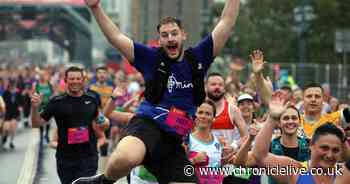 Great North Runners cross the Tyne Bridge in 65 foggy, soggy but gloriously uplifting photos