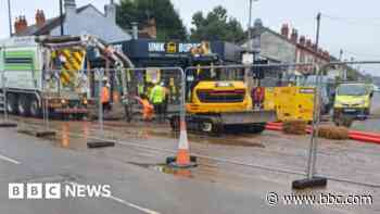 Road reopens after burst pipe chaos