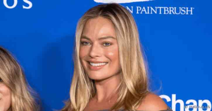 Margot Robbie glowing as she graces red carpet with baby bump for first time