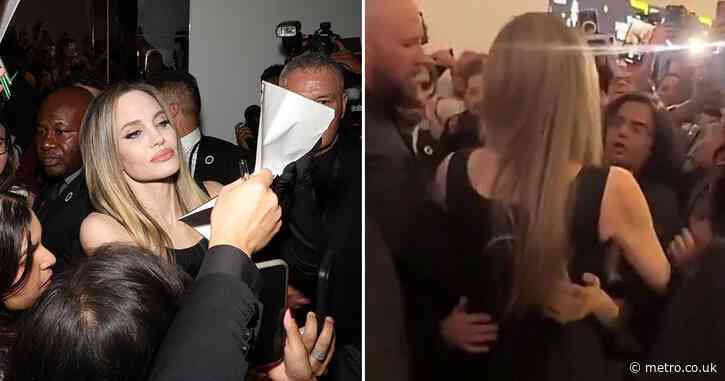 The shocking moment Angelina Jolie is grabbed by an overzealous fan in chaotic scrum