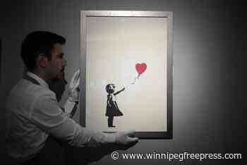 2 men charged with stealing a famous Banksy image from a London art gallery