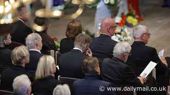 David Beckham's grief for his friend and mentor: Emotional football star puts hand on Sven-Goran Eriksson's coffin and appears to wipe away tear as he bids farewell at ex-England manager's funeral