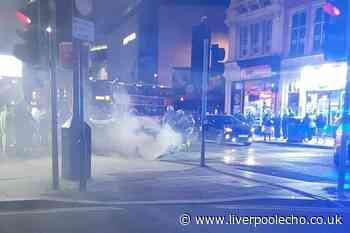 Fire fighters tackle blaze after taxi catches fire in city centre