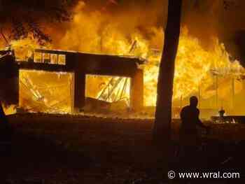 Garage with propane tanks inside bursts into flames overnight in Moore County