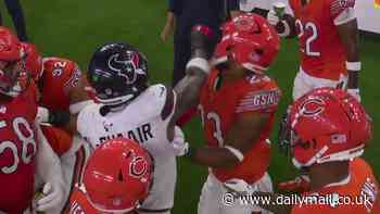 Lucky Texans linebacker gets away with PUNCHING his opponent in the face during ugly sideline scuffle