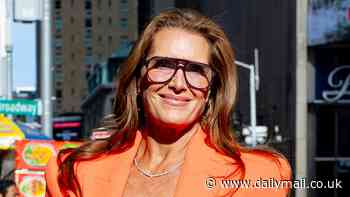 Brooke Shields, 59, looks youthful in a bright orange pantsuit in NYC while promoting her book about aging