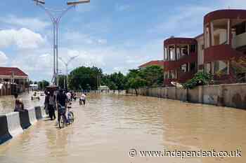 Hundreds of inmates escape after floods pull down prison walls