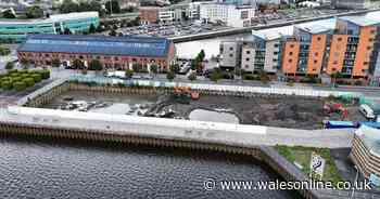 New block of flats is being built overlooking river and marina