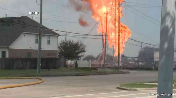 Pipeline explosion shooting a towering pillar of flame over a Houston suburb