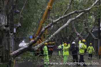 2 people reported dead in China as Typhoon Bebinca is downgraded to a tropical storm