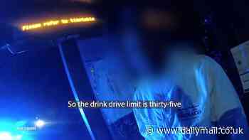 Moment drink-driving father is caught at the wheel with his two children in the car