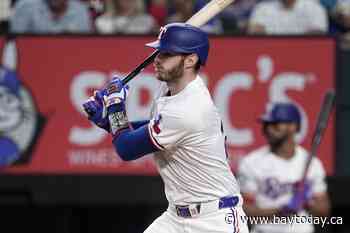 Struggling Heim has key hit as Rangers rout Blue Jays 13-8