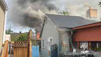 Fire crews rescue woman, dog from burning Southeast Portland home