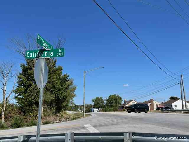 Police block stretch of Hillegas after crash takes down utility lines.