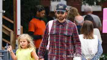 Bradley Cooper is every inch the doting dad as he holds hands with daughter Lea during NYC stroll