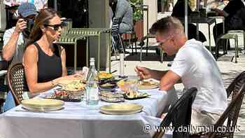 Trouble in paradise? Candice and David Warner appear to have a tense conversation as they film a project in Sydney