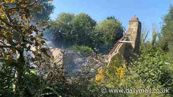 'Unimagineable' explosion destroys pretty bungalow as woman is airlifted to hospital and family dog survives unharmed