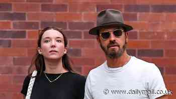 Justin Theroux, 53, and fiancee Nicole Bloom, 30, hold hands in New York City... after getting engaged in Italy