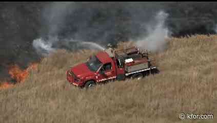 Logan Co. grassfire leaves mobile home destroyed, one firefighter injured