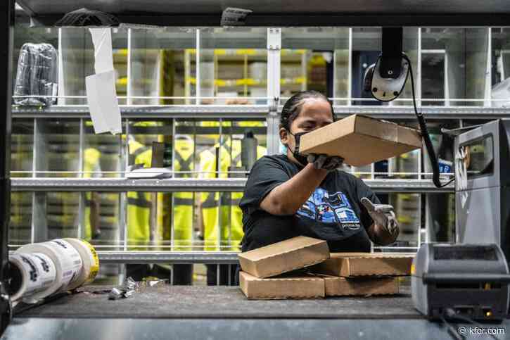 Amazon raising pay, offering free Prime to warehouse workers