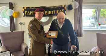 Military veteran presented with a special badge as he celebrates 100th birthday