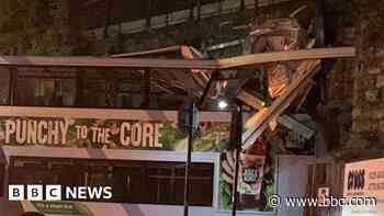 Investigation after bus crashes into bridge