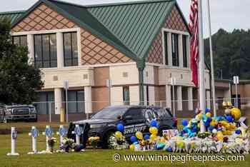 Mom of suspect in Georgia school shooting indicted and is accused of taping a parent to a chair