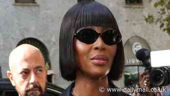 Naomi Campbell turns heads in a racy fishnet dress as she attends the Dolce & Gabbana show during Milan Fashion Week