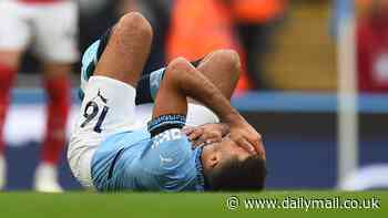 Manchester City superstar Rodri forced off with serious-looking knee injury in first half of bumper clash against Arsenal