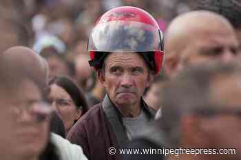 An estimated 180,000 motorcyclists converge at Portuguese shrine to have their helmets blessed.