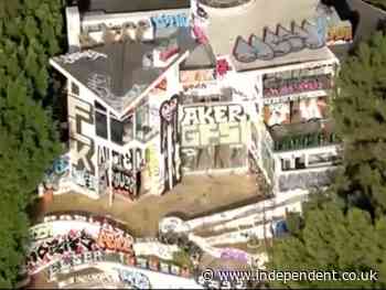 Squatters target multi-million dollar mansion in LA creating an eyesore for wealthy neighbors