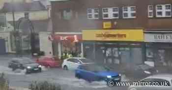 UK weather: Streets left under water as flooding causes damage to buildings and cars