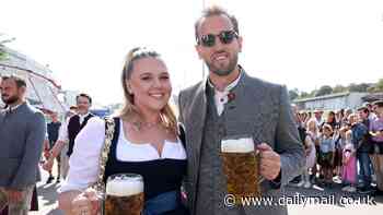 Harry Kane leads Bayern Munich's Oktoberfest celebrations as the England captain enjoys a beer with wife his Kate, team-mates - including fellow Londoner Michael Olise - and their WAGs