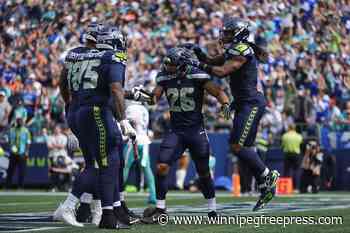 Seahawks roll to 24-3 win over Dolphins as Miami deals with another QB injury