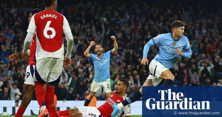 Stones rescues Manchester City with late equaliser against 10-man Arsenal