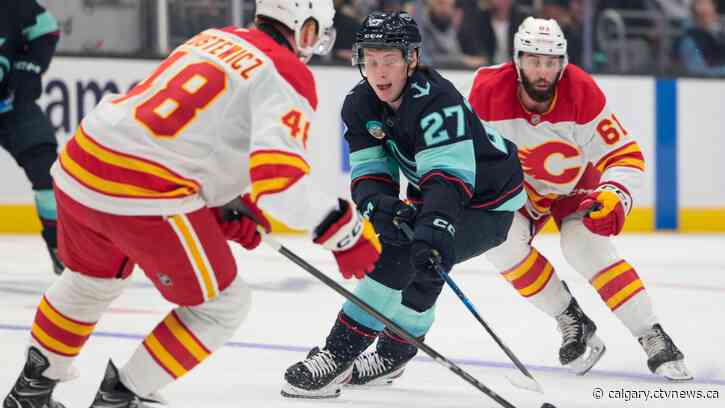 Flames jump out to a hot start, burn Kraken 6-1