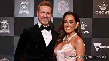 Eyes up here, please! Nathan Buckley's girlfriend Brodie Ryan shows off her ample cleavage in plunging gown at the Brownlow Medal 2024