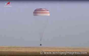 A Soyuz capsule with 2 Russians and 1 American from the International Space Station returns to Earth