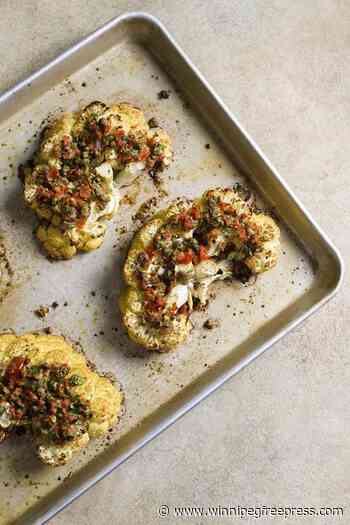 Nutty Parmesan, briny capers and pickled peppers turn cauliflower steaks into a satisfying main