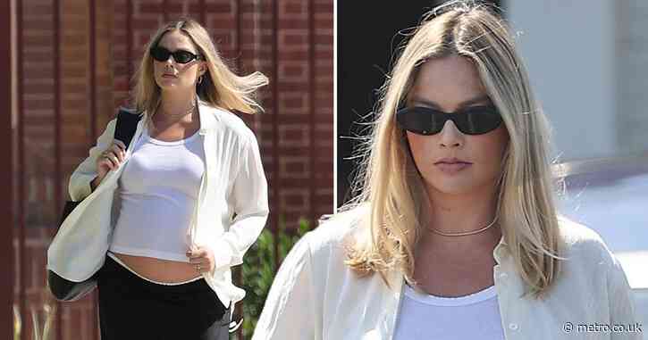 Heavily pregnant Margot Robbie exposes bare baby bump on errand-run