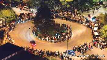 'Fast & Furious': Boy racers filmed doing doughnuts round roundabouts as police arrest two at car meet attended by 500